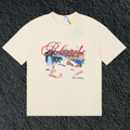 Rhude Cannes Tropical Beach Scene Script Cream Oversized T‑Shirt